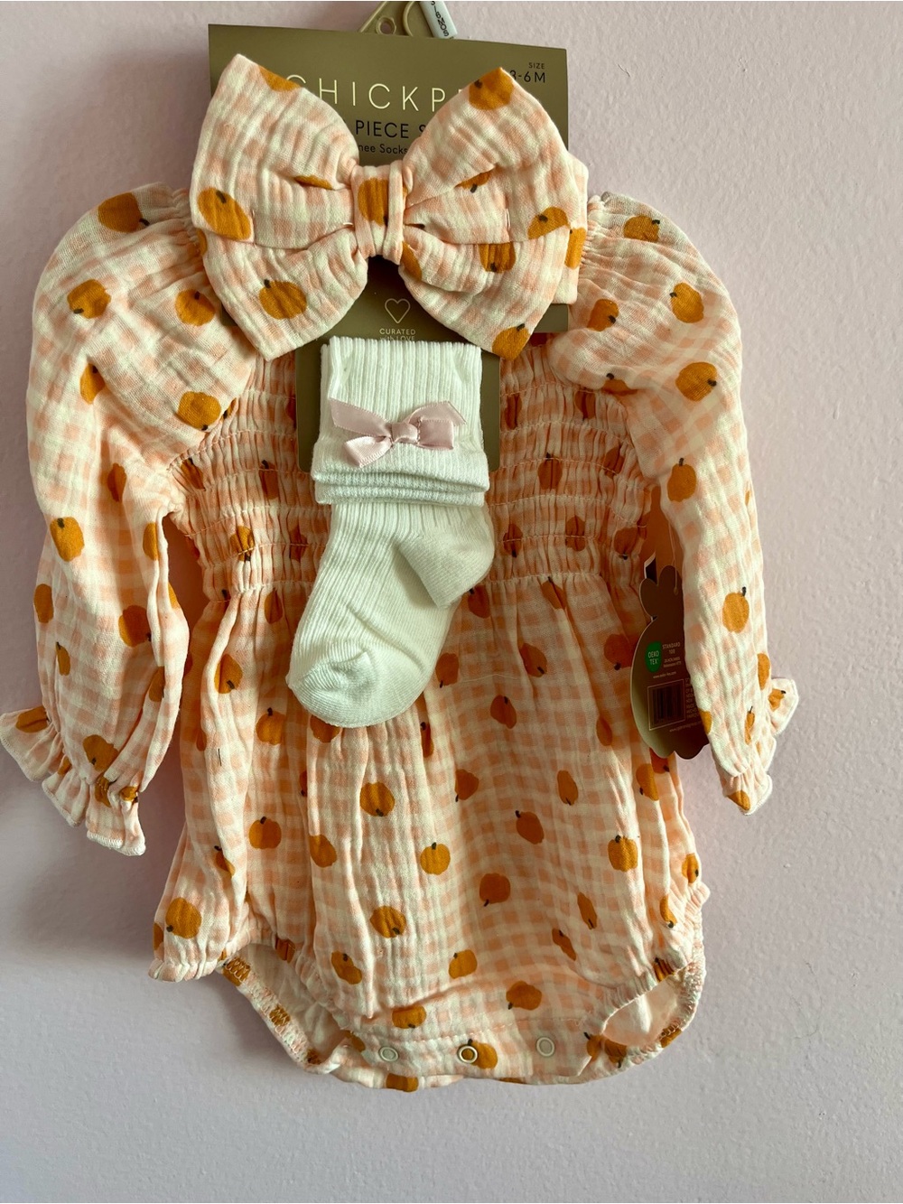 chick pea peach gingham romper set with cream socks and bow